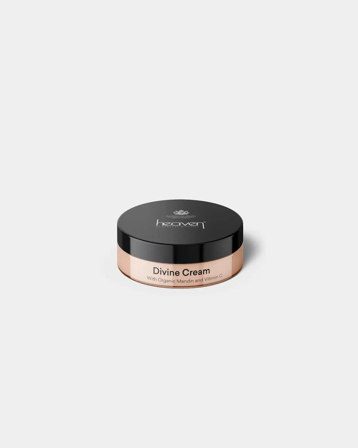 Small Jar of 'Divine Cream' with 'heaven' branding on a white background