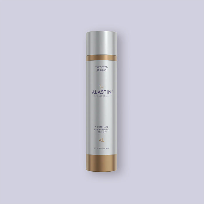 Alastin A-Luminate Brightening Serum bottle on a light purple background