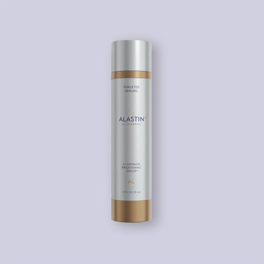 Alastin A-Luminate Brightening Serum bottle on a light purple background