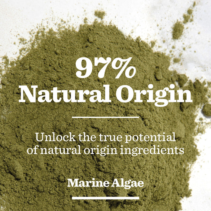 Powdered green marine algae scattered on a white surface with text overlay: 97% Natural Origin. Unlock the true potential of natural origin ingredients in men’s skincare with our Age Defence Eye Roll-On featuring Marine Algae.
