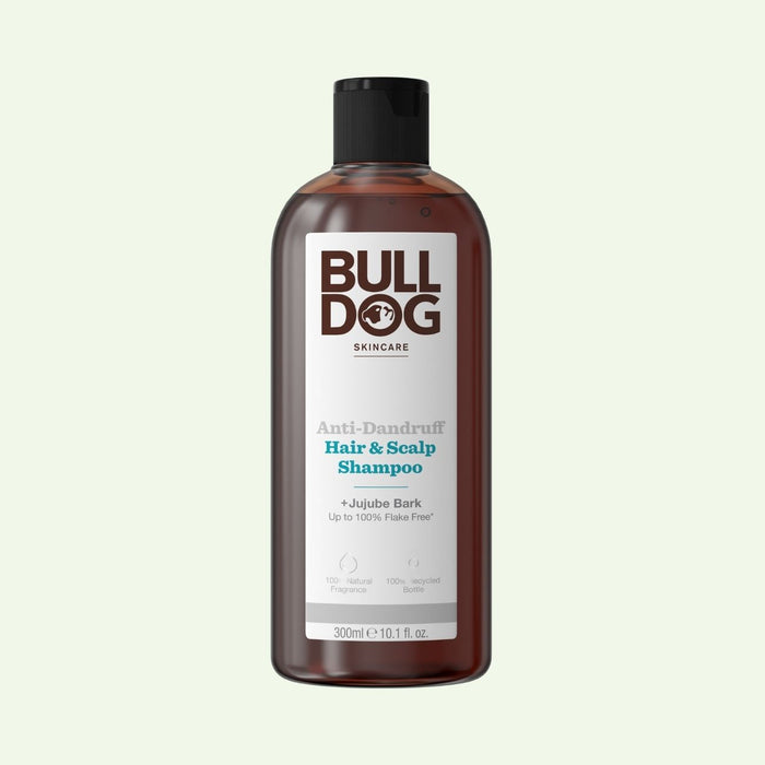 A 300ml (10.1 fl oz) bottle of Anti-Dandruff Shampoo for dandruff relief, in a brown recycled plastic bottle with a black cap and white label, featuring Jujube Bark.