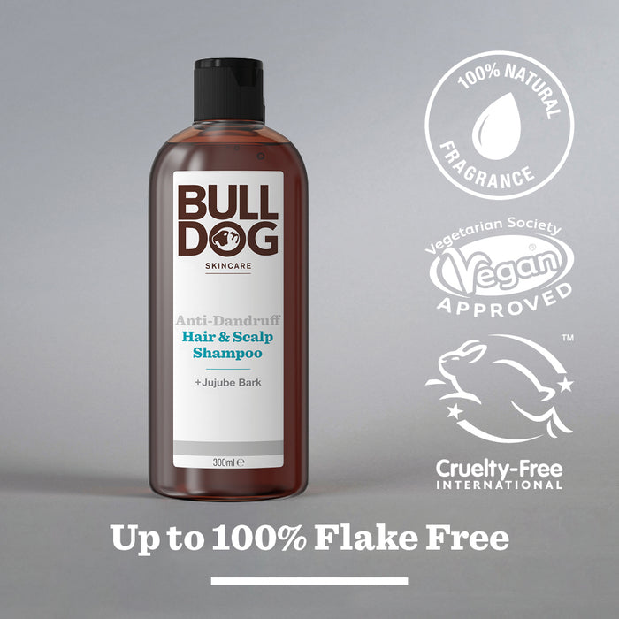 A bottle of Anti-Dandruff Shampoo made with recycled plastic is shown, labeled 100% natural fragrance, vegan approved, cruelty-free, and offers dandruff relief for up to 100% flake-free results.