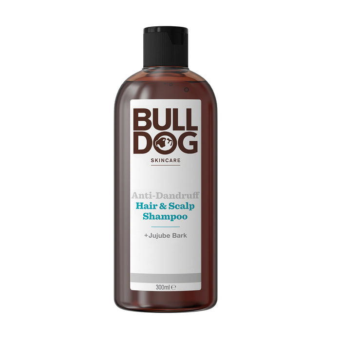 A 300ml bottle of Anti-Dandruff Shampoo in recycled brown plastic with a black cap and white label showing the brand and product details. Contains Jujube Bark for hair and scalp care.