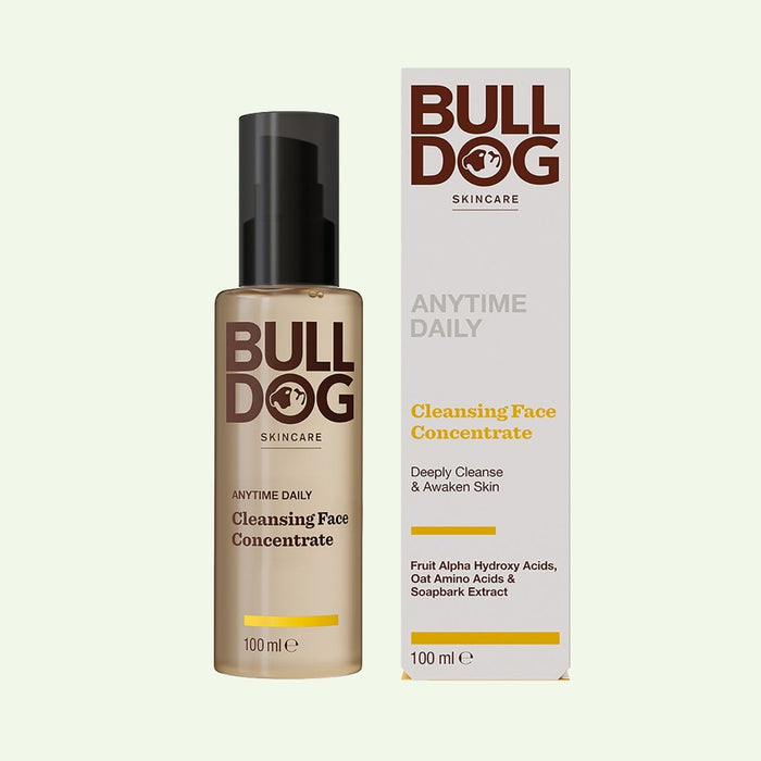 A bottle of Anytime Daily Cleansing Face Concentrate stands beside its matching box, both displaying the same branding and product details against a light backdrop.
