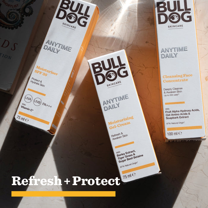 Three Bulldog Skincare products—Moisturiser SPF 30, Anytime Daily Moisturising Gel Cream, and Cleansing Face Concentrate—made with natural origin ingredients are arranged on a sunlit surface. Text reads, Refresh + Protect for ultimate skin hydration.
