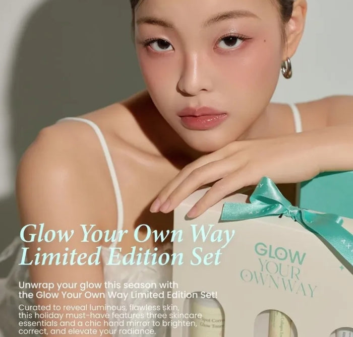 Woman holding a 'Glow Your Own Way' limited edition set with text overlay.
