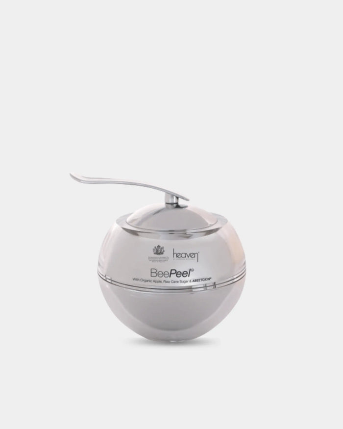 Silver spherical shaped skincare jar for the heaven bee peel on a white background.