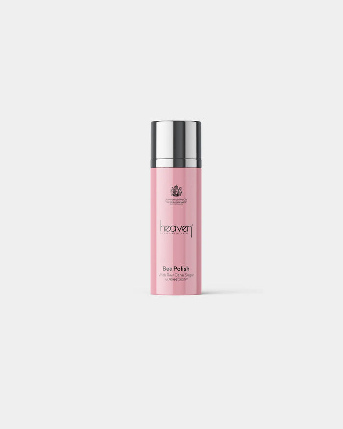 Pink bottle with silver cap on a light gray background