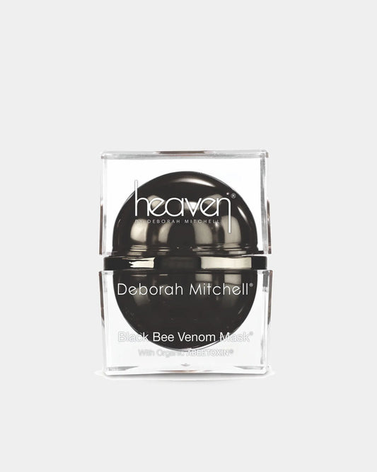 Black bee venom mask in a clear container with 'heaven' branding on a white background