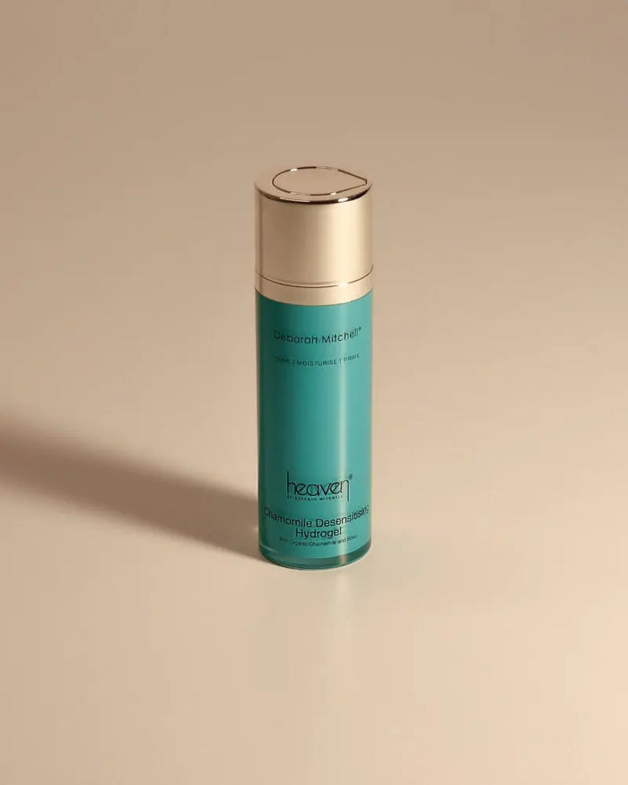 Chamomile desensitising hydrogel product shot on beige background. Blue bottle with a silver top.