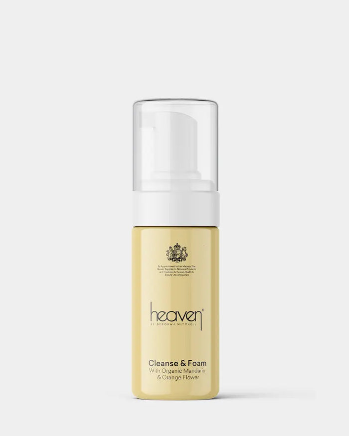 Foam cleanser bottle with white cap on a light gray background