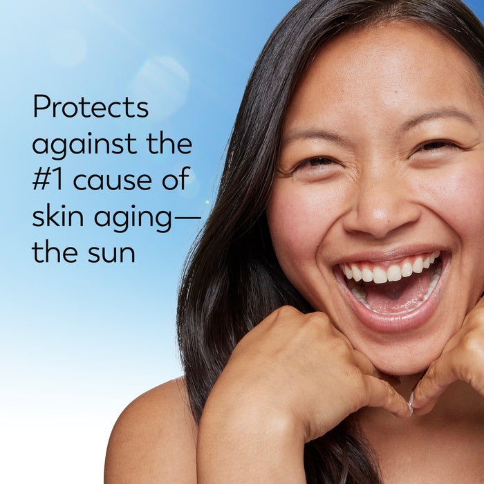 Model posing and smiling. Protects against the #1 cause of skin aging. The sun.