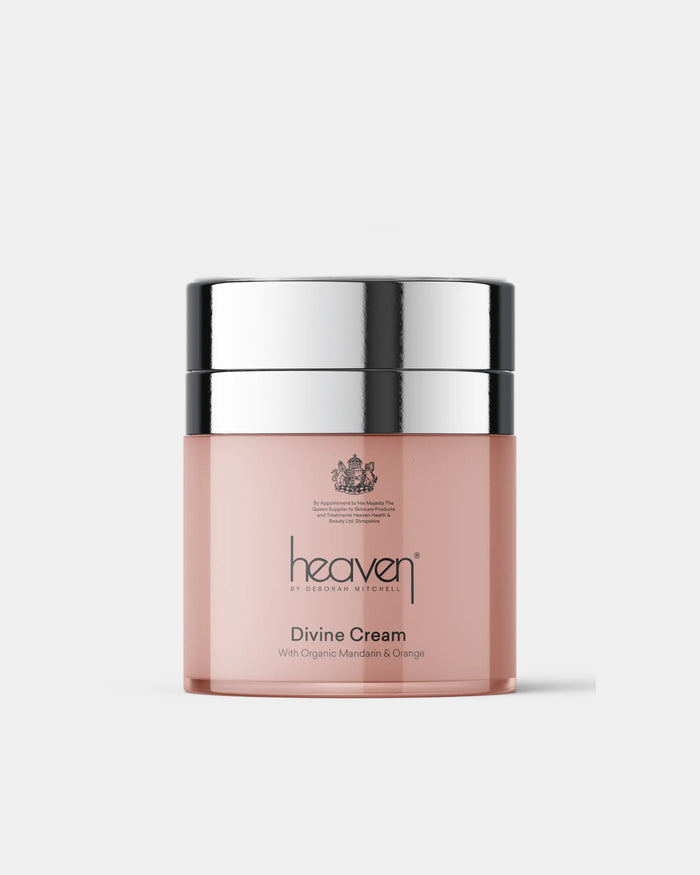 Pink jar of 'heaven' Divine Cream with silver lid on a white background