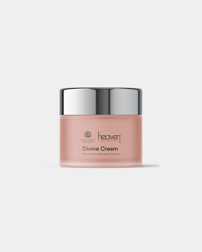 Pink jar of 'Divine Cream' with silver lid on a white background
