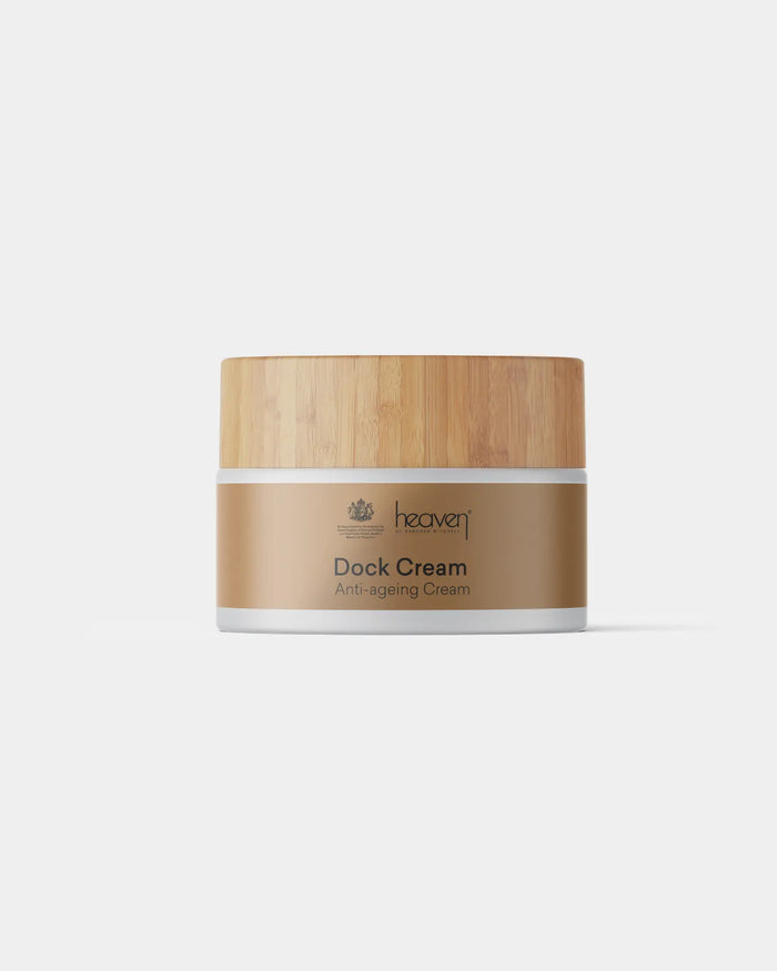 Heaven Dock Cream in a white jar with a natural wood lid and brown label.