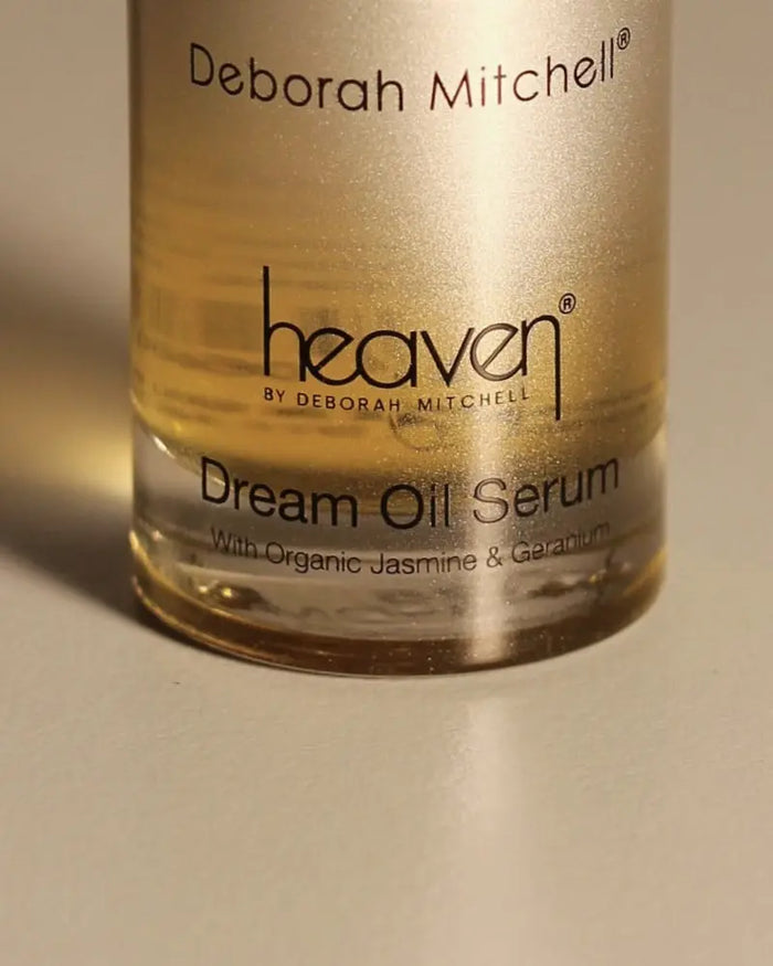 Bottle of Deborah Mitchell heaven Dream Oil Serum on a beige background