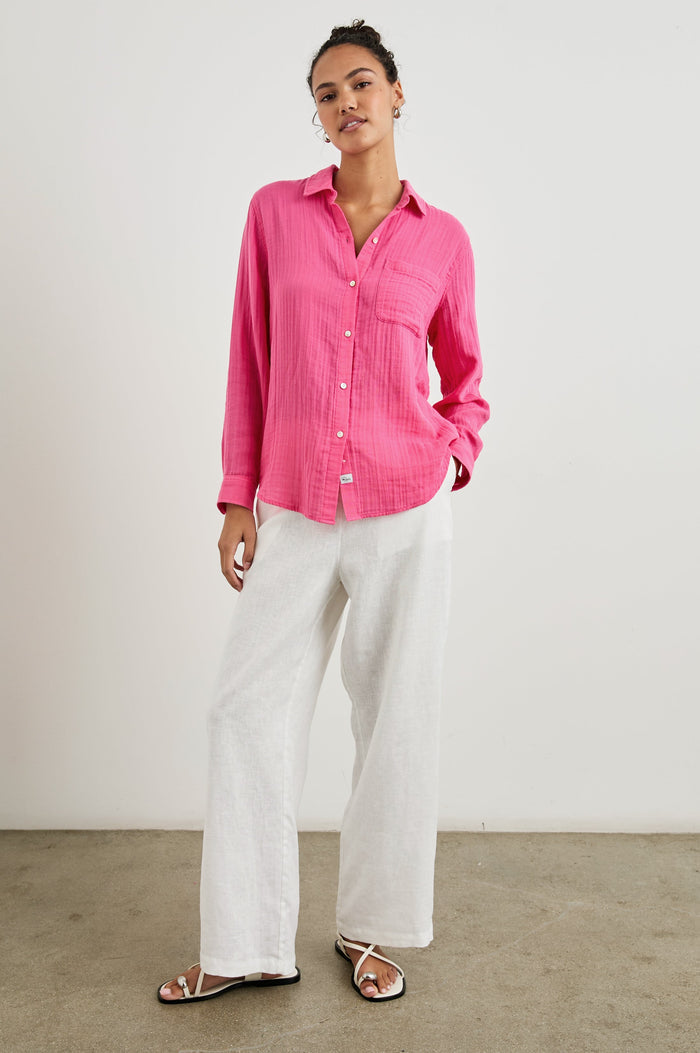 Ellis Long-Sleeve Button Down with Cuffs and a Patch Chest Pocket in Hibiscus Colorway - Front Untucked Full body View Featured on Model