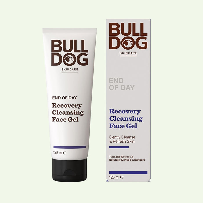 A tube and box of End of Day Recovery Cleansing Face Gel with brown and blue text on white packaging, highlighting naturally derived cleansers, turmeric extract, and benefits like gently cleansing and refreshing skin.
