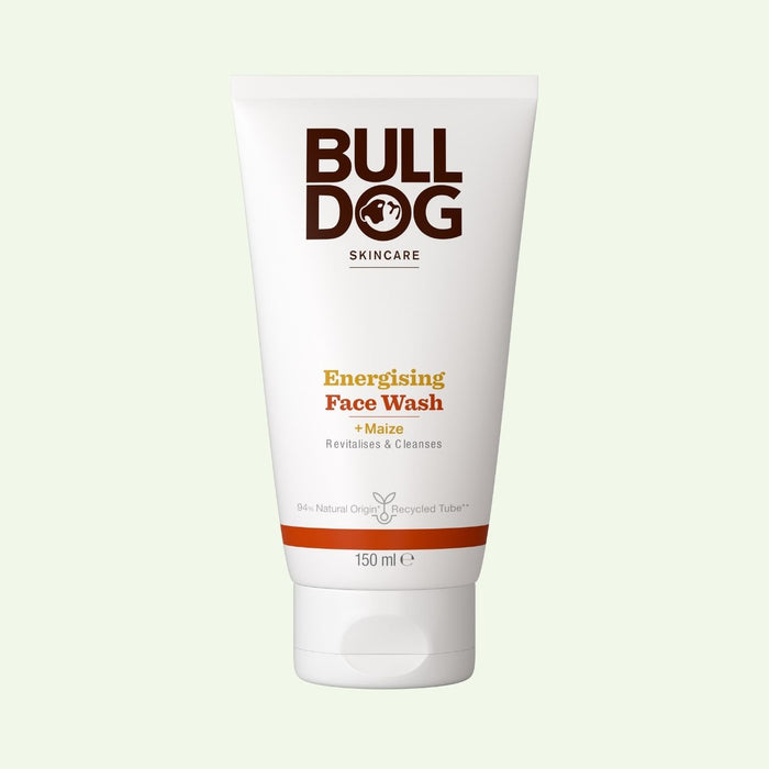 A 150 ml white tube of Energising Face Wash for men with maize is shown on a light green background. Made with natural-origin ingredients, this face wash cleanses and revitalises tired skin.