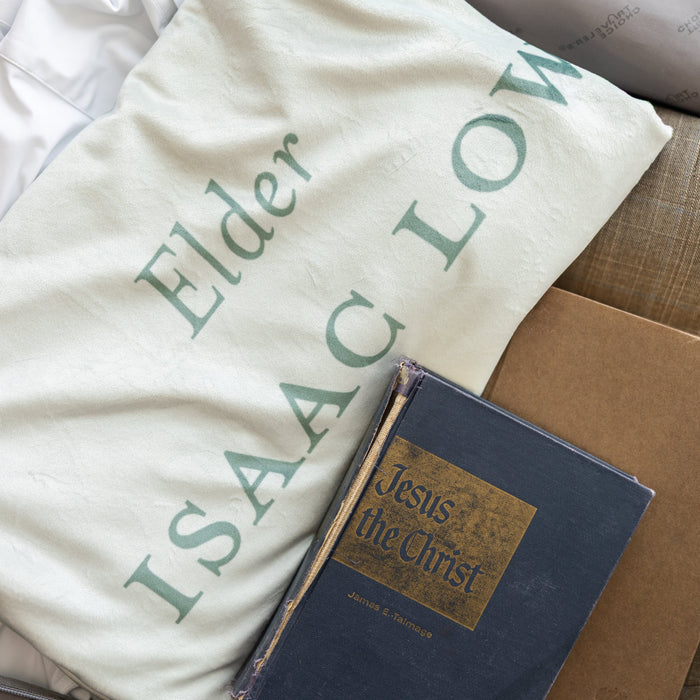 The Gathering LDS missionary blanket displayed with scriptures, featuring personalized missionary details and faith-centered artwork.