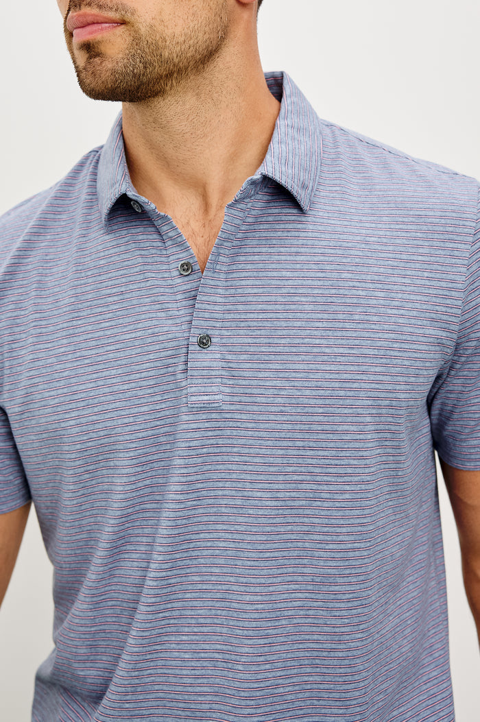 Merced Golf Polo in TENCEL™ Poly Blend With Collar, Quarter Placket, Short Sleeves, and Classic Fit in Hibiscus Mirage Stripe Colorway - Upper Body Front View Featured on Model