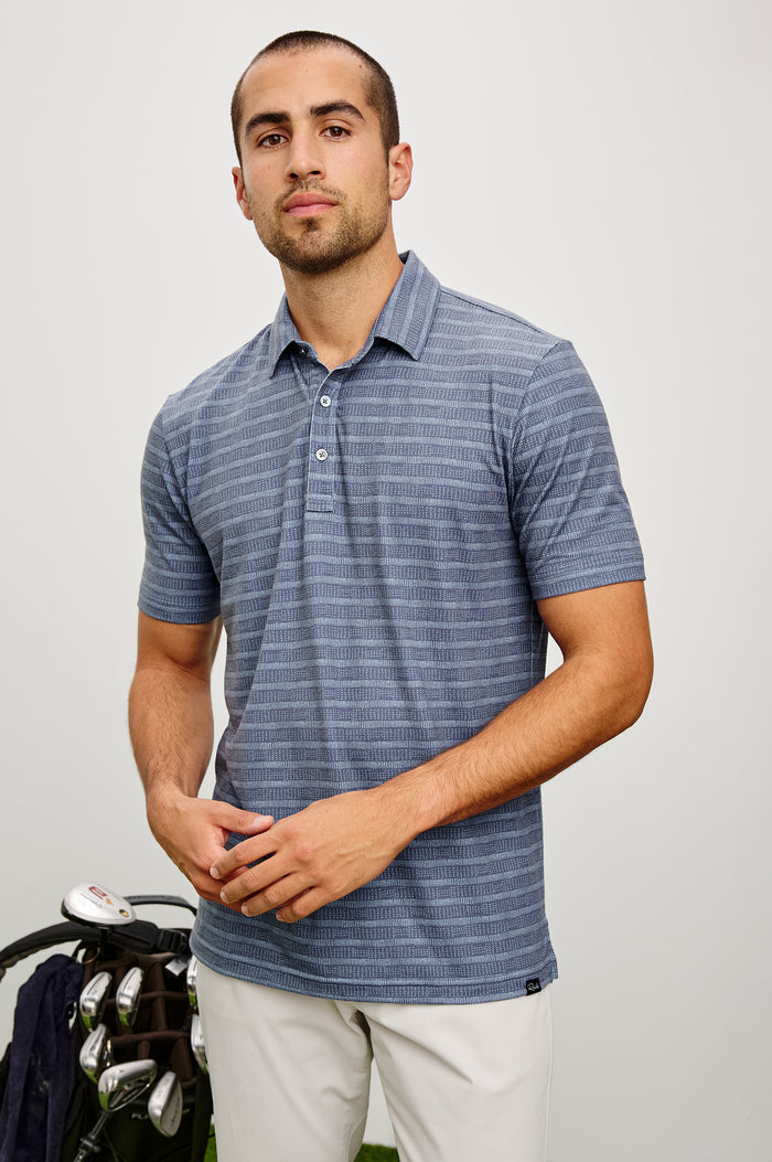 Merced Golf Polo in TENCEL™ Poly Blend With Collar, Quarter Placket, Short Sleeves, and Classic Fit in Hibiscus Mirage Stripe Colorway - Upper Body Front View Featured on Model