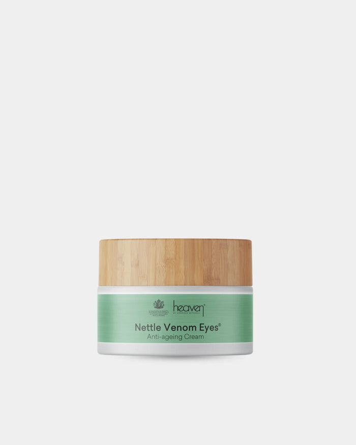 Jar of Nettle Venom Eyes anti-aging cream with a wooden lid on a white background