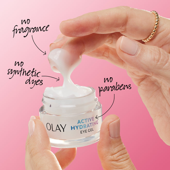 Model dipping fingers into Olay Active Hydrating Eye Cream. No fragrance, no synthetic dyes, no prarbens