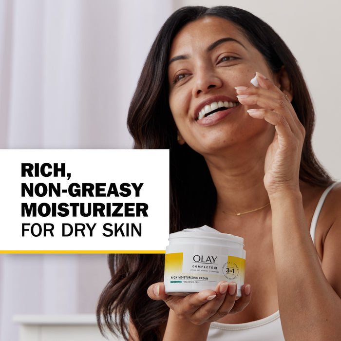 Model applying moisturizer cream to face. Rich Non greasy moisturizer for dry skin