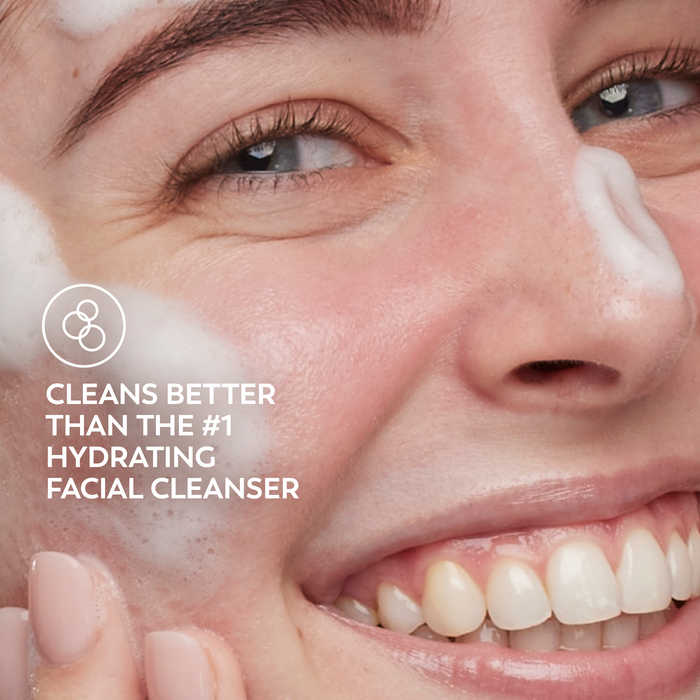 Model posing and smiling while applying melts cleanser to face. Cleans better than the #1 hydrating facial cleanser