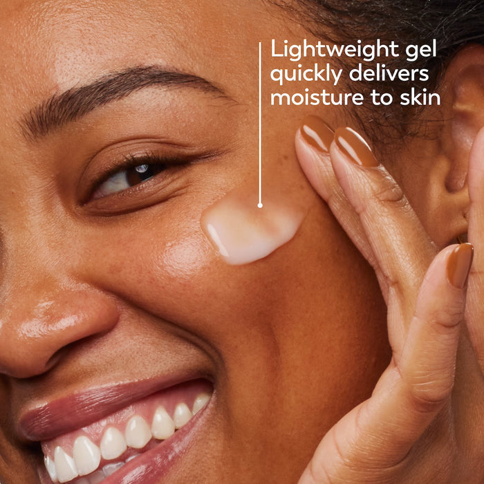 Model posing and smiling applying Olay Hyaluronic Ultralight Gel. Lightweight gel quickly delivers moisture to skin