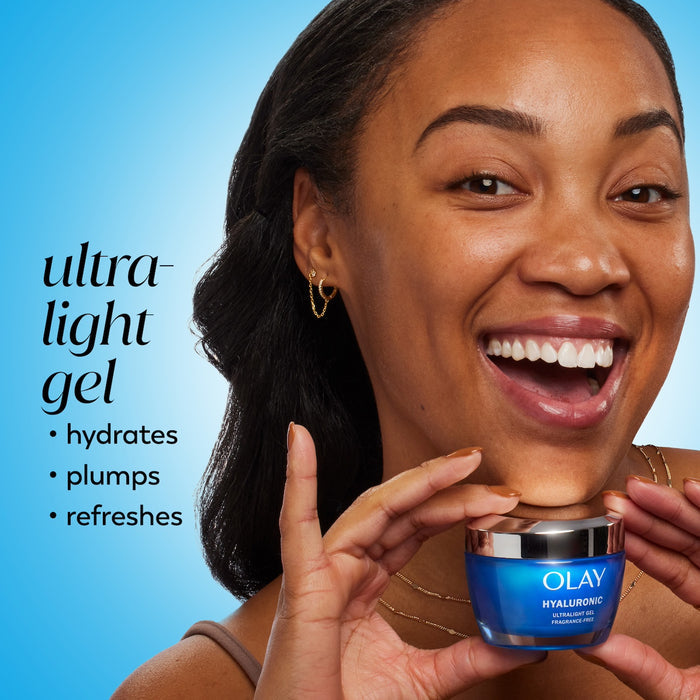 Model posing with Olay Hyaluronic Ultralight Gel jar. Ultra light gel hydrates, plumps, refreshes