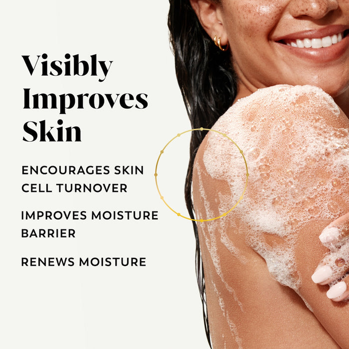 Model posing lathering body wash on skin. Visibly improves skin. Encourages skin cell turnover. Improves moisture barrier. Renews moisture.