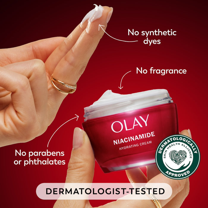 Model dipping fingers in Olay Niacinamide Hydrating Cream. No synthetic dyes. No fragrance, no parabens or phthalates. Dermatologist tested. Dermatologically approved.