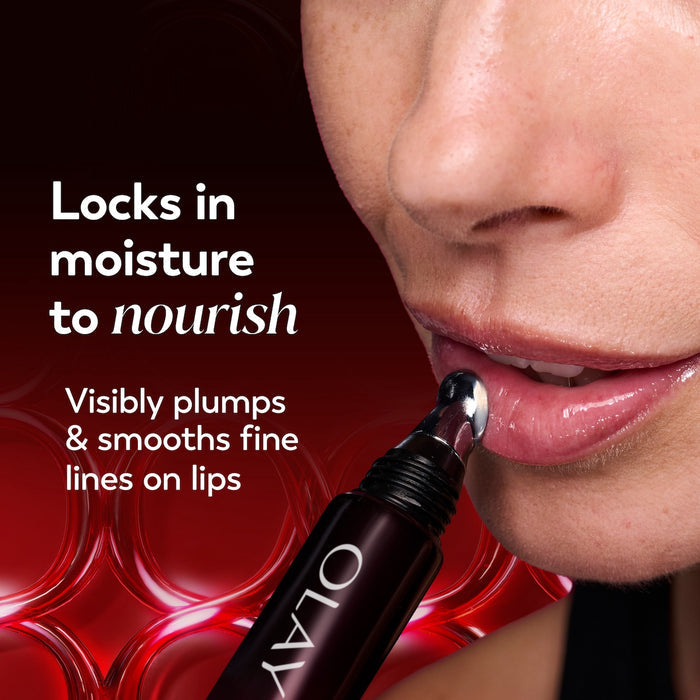 Model posing applying Regenerist Lip Plumping Treatment. Locks in moisture to nourish. Visibly plumps and smooths fine lines on lips.