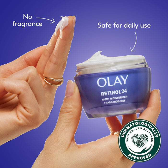 Model dipping fingers in Olay Retinol 24 MAX Night Moisturizer cream. No fragrance. Safe for daily use. Dermatologically approved.
