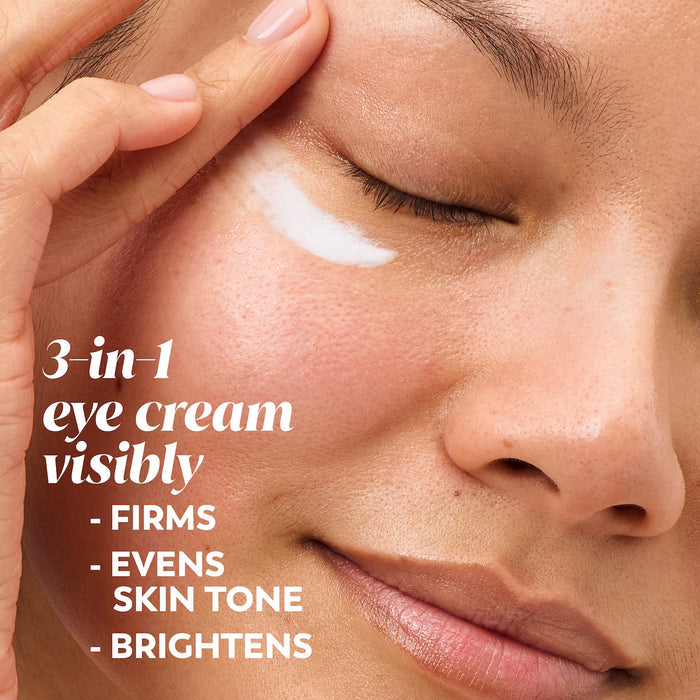 Model applying eye cream under eye. 3 in 1 eye cream visibly firms evens skin tone, brightens.