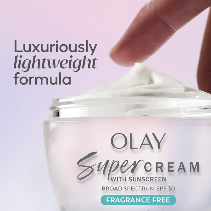 Model dabbing fingers in Olay Super Cream fragrance free.