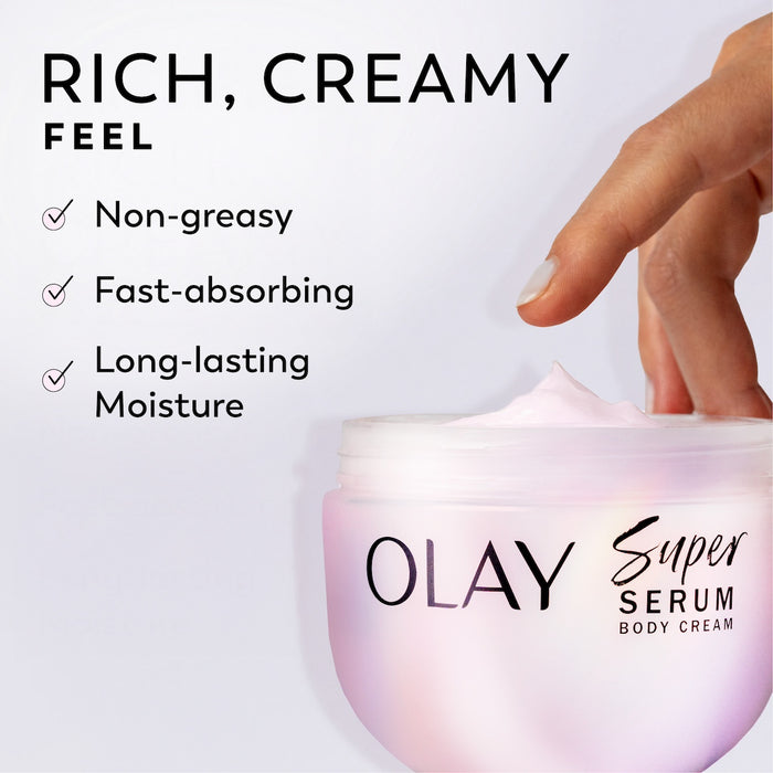 Model dipping fingers in Olay Super Serum Body Cream jar. Rich, creamy feel. Non-greasy, fast absorbing, long lasting moisture