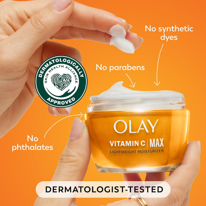 Model dipping fingers in Vitamin C MAX Lightweight Hydrating Moisturizer jar. No synthetic dyes. No parabens. No phthalates. Dermatologist tested. Dermatologically approved.