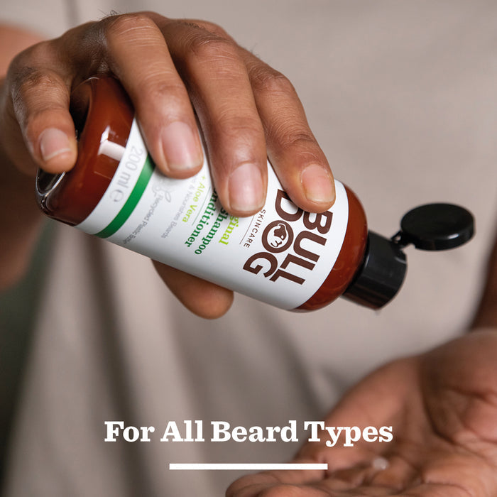 A person pours Original Beard Shampoo and Conditioner into their hand. Text below reads, For All Beard Types.