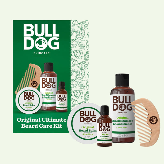 Original Ultimate Beard Care Kit includes a green box, beard balm, oil, shampoo & conditioner, and a wooden comb—everything you need for beard care, all presented on a light background.