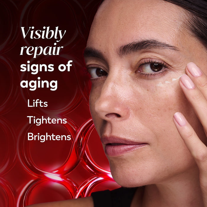 Model posing using Regenerist Eye Wrinkle Correcting Treatment on face. Visibly repair signs of aging. Lifts tightens brightens