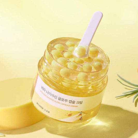 ROUND LAB Vita Niacinamide Glow Capsule Cream a lightweight Korean vitamin-enriched gel-cream moisturizer designed to brighten dull skin and provide deep hydration for a "glass skin" finish. It features unique moisturizing capsules suspended in a refreshing gel base that melt upon contact with the skin.