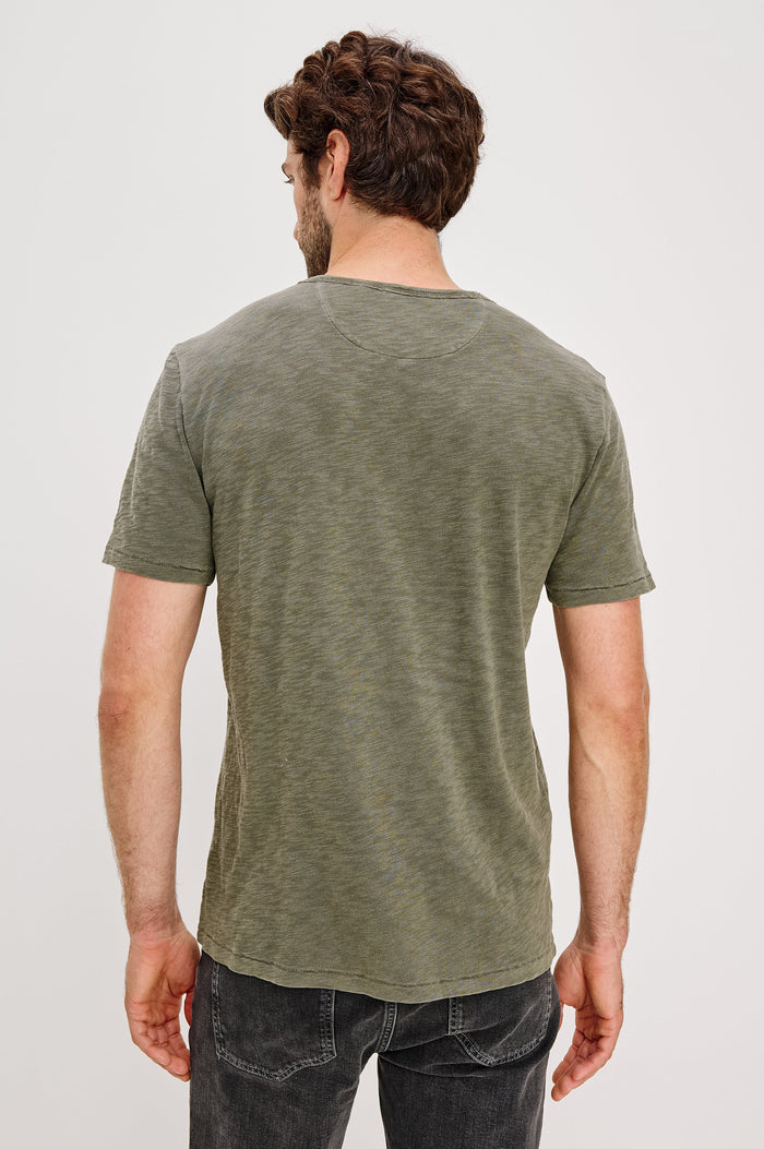 Skipper Short-Sleeve T-shirt with a Crew Neck and a Chest Patch Pocket in Surplus Colorway, a green - Back View Featured on Model