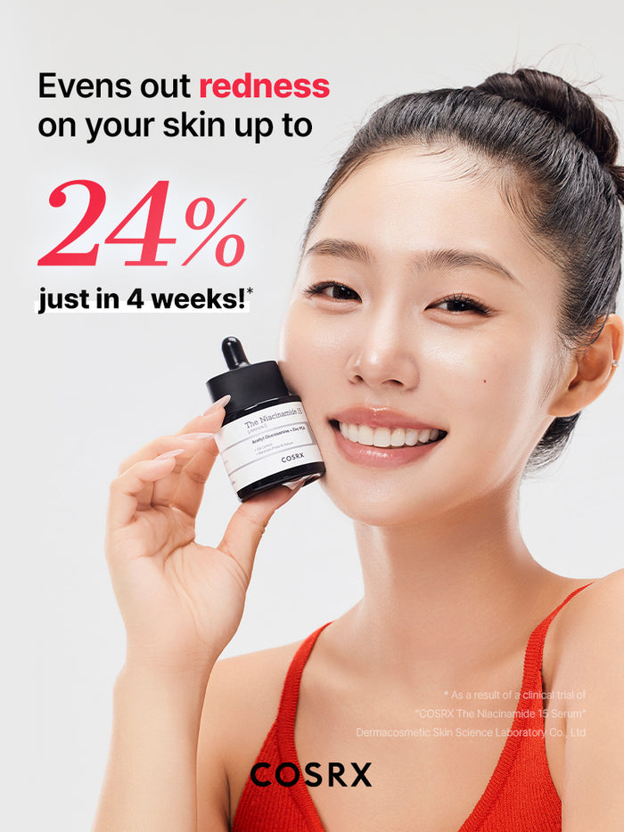 Model holding COSRX The Niacinamide 15 Serum with clinical claim of 24% redness reduction in 4 weeks; high-strength niacinamide formula proven to calm acne inflammation and even out post-blemish pigmentation on sensitive, oily skin.