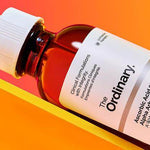 Cosmetic bottle with 'The Ordinary' branding on a white background